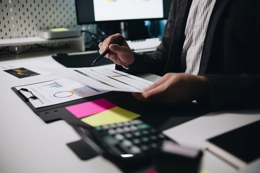 Image of an expert auditor reviewing files